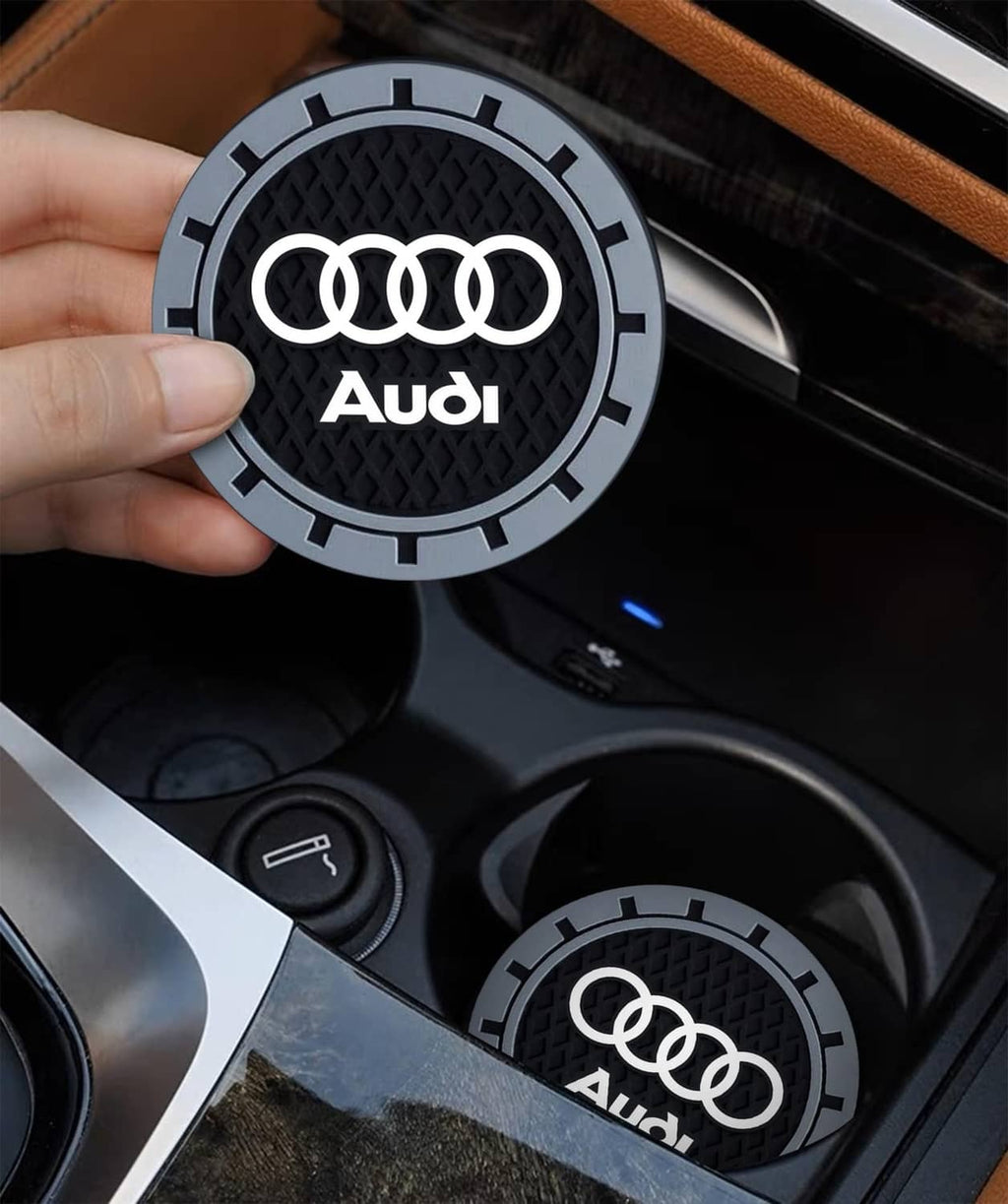 Single Audi logo car cup holder coaster, black textured center with grey outer ring