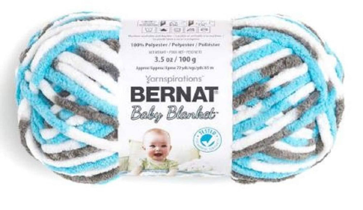 Bernat Baby Blanket yarn skein with light blue, white, gray striped super bulky