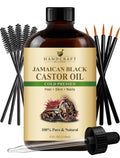 Cold-pressed Jamaican black castor oil bottle, amber brown with black cap, dropper and brushes