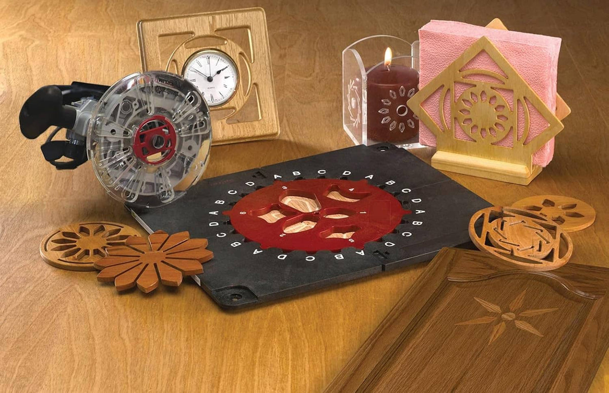 Router inlay template jig kit laid out with red templates and wooden cutout shapes