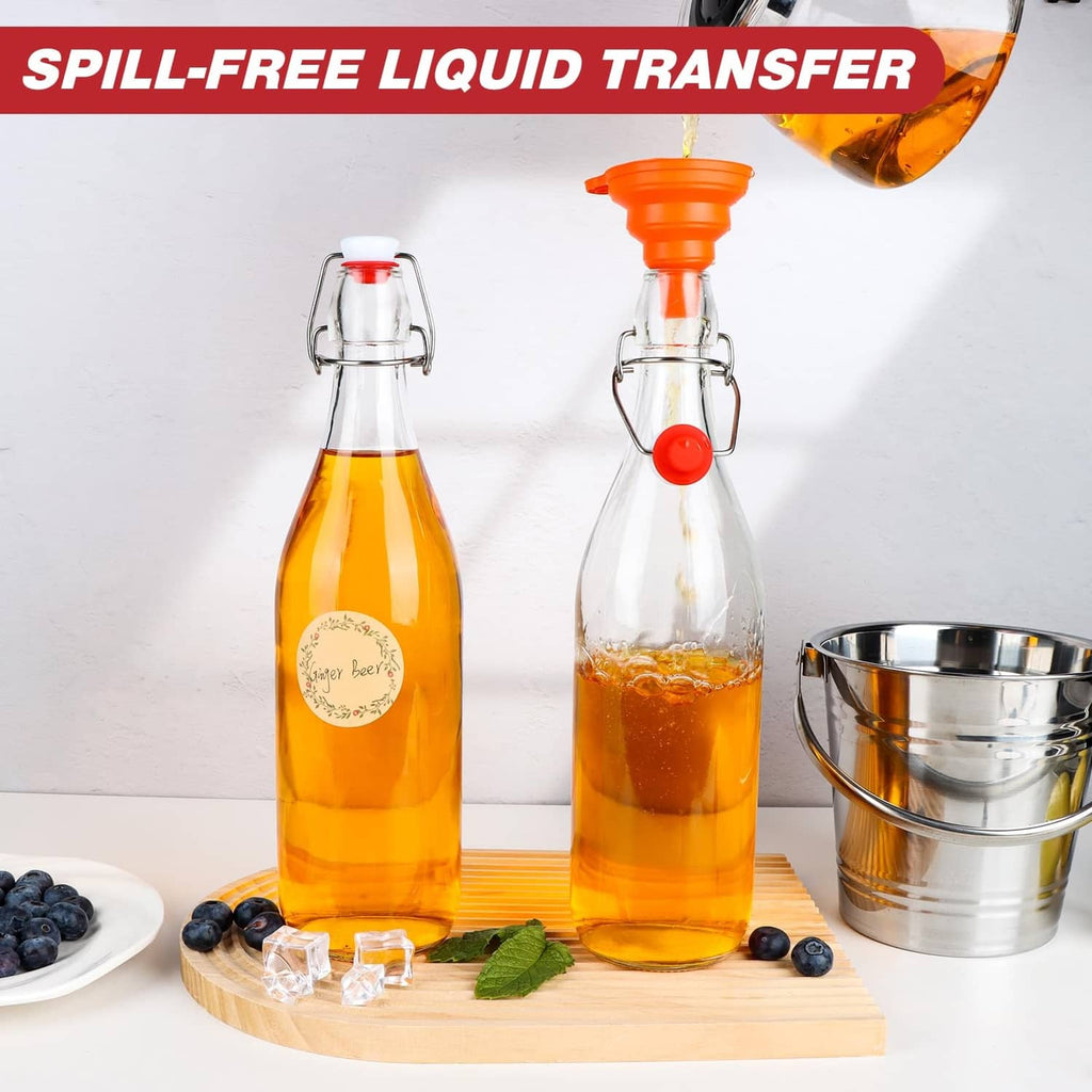Clear glass swing-top bottles with red caps on tray; amber liquid containers and spout