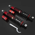 Adjustable rear air shock absorbers with red aluminum bodies, black springs, and mounting hardware