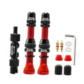 Tubeless Schrader valve stems kit with red 60mm stems, black knurled caps and tools