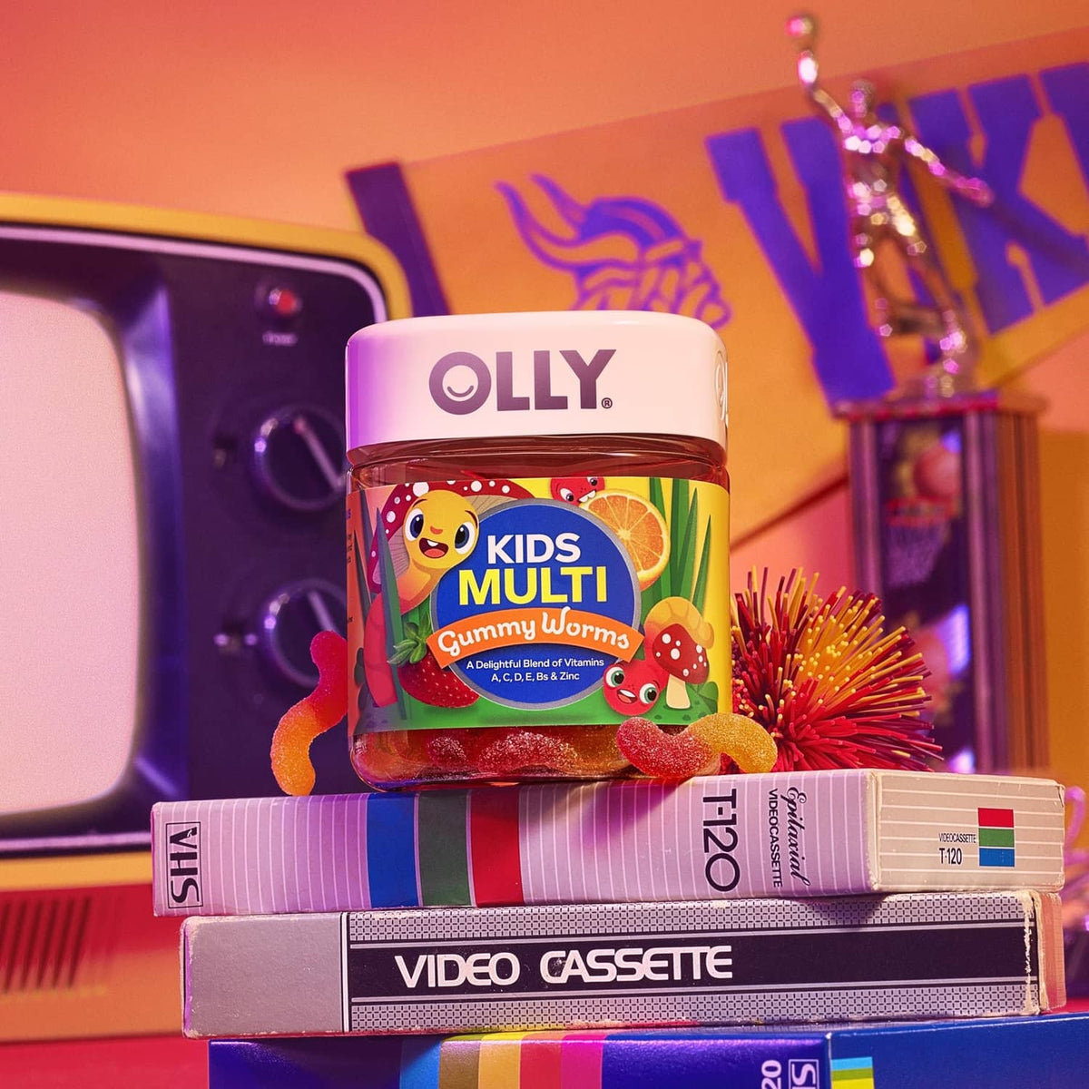 OLLY Kids multi gummy worms bottle with colorful label and gummy worms at base