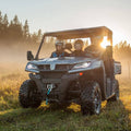 Foldable UTV rearview side mirror with black housing and clear rectangular lens, mounted on a roll cage