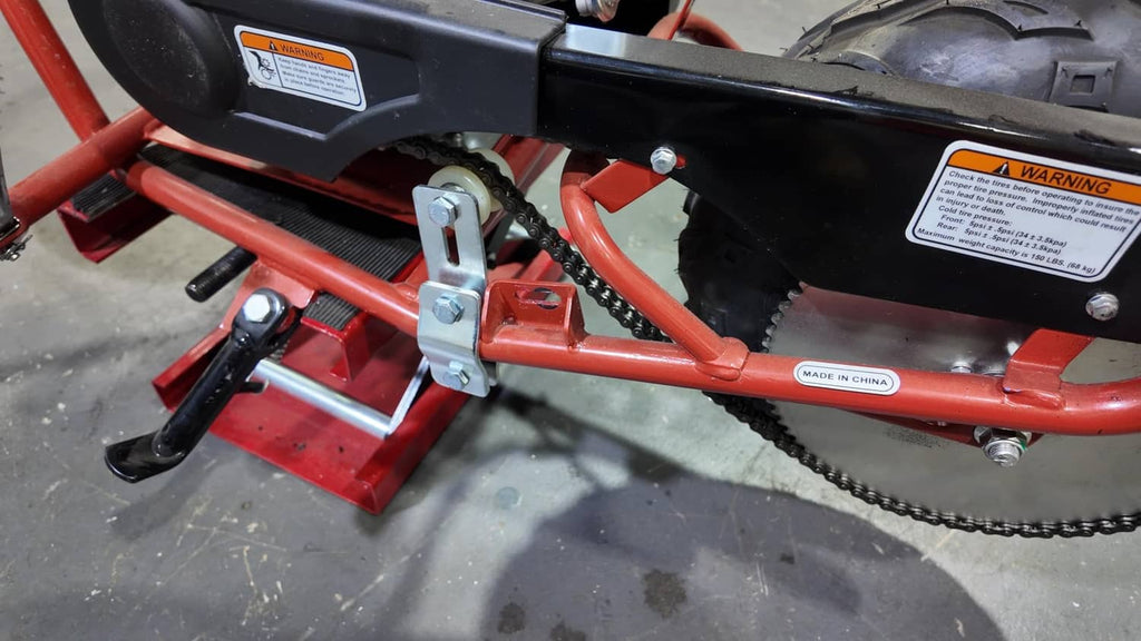 Chain tensioner bracket mounted on frame, with guide wheel and secured bolts