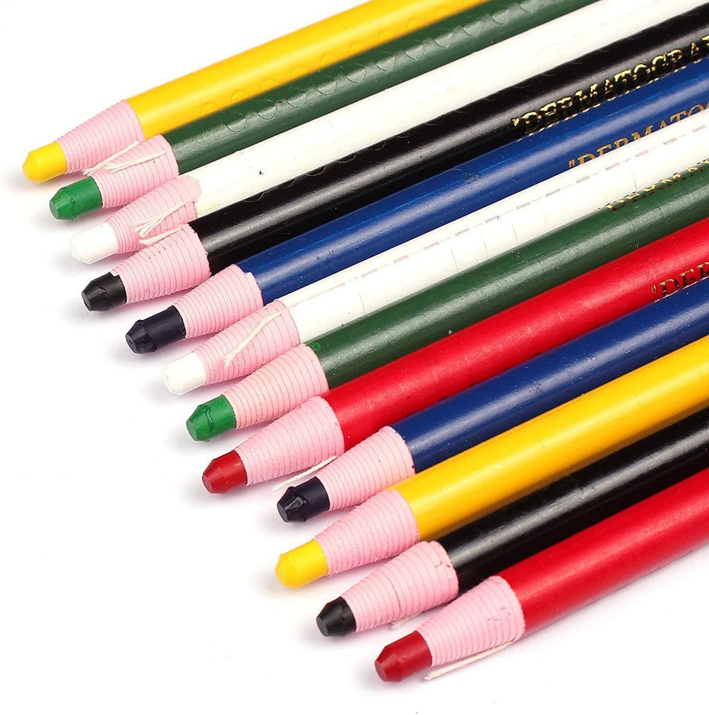 Close-up of colored diamond peel-off grease pencils with black tips and caps.