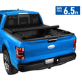 Black soft roll-up vinyl tonneau cover over pickup truck bed, closed