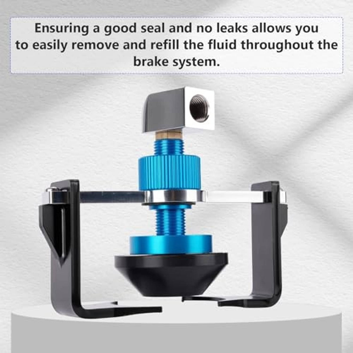Brake master cylinder adapter with blue adjustment knob and black clamp bracket