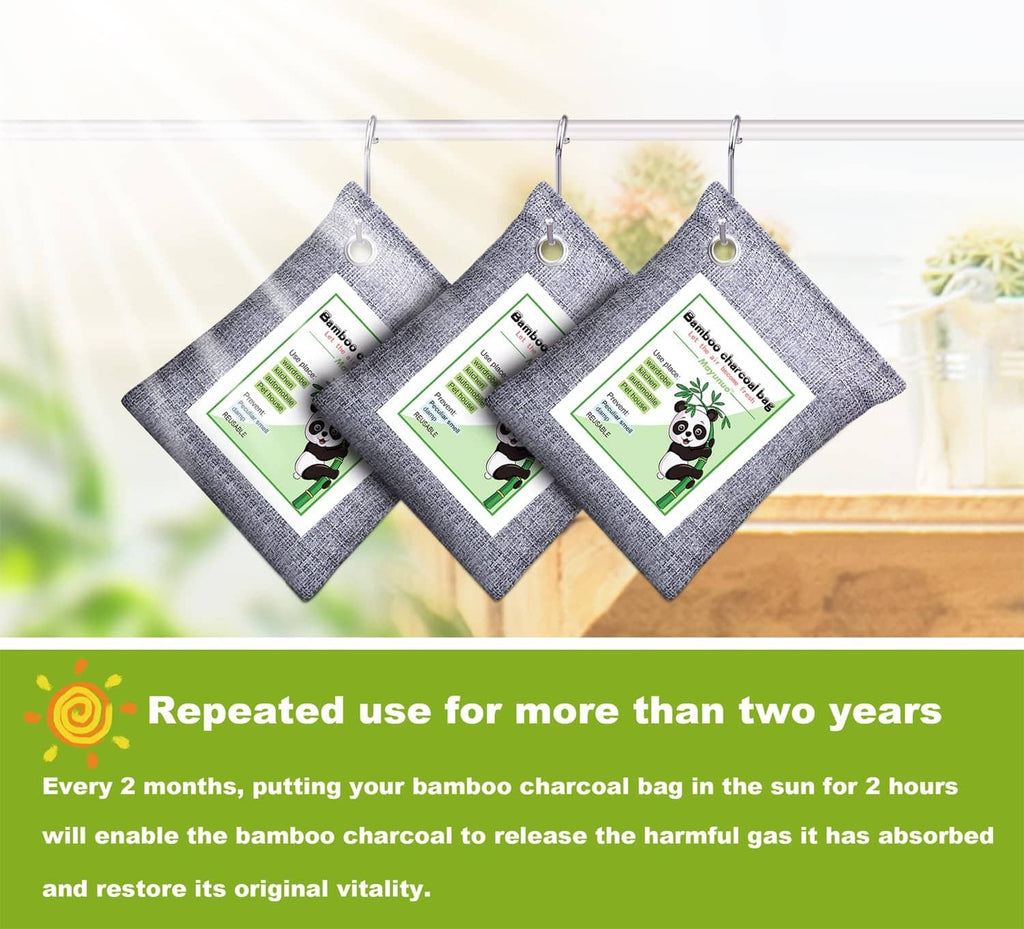 Three hanging grey odor absorber bags with metal grommets and printed labels.