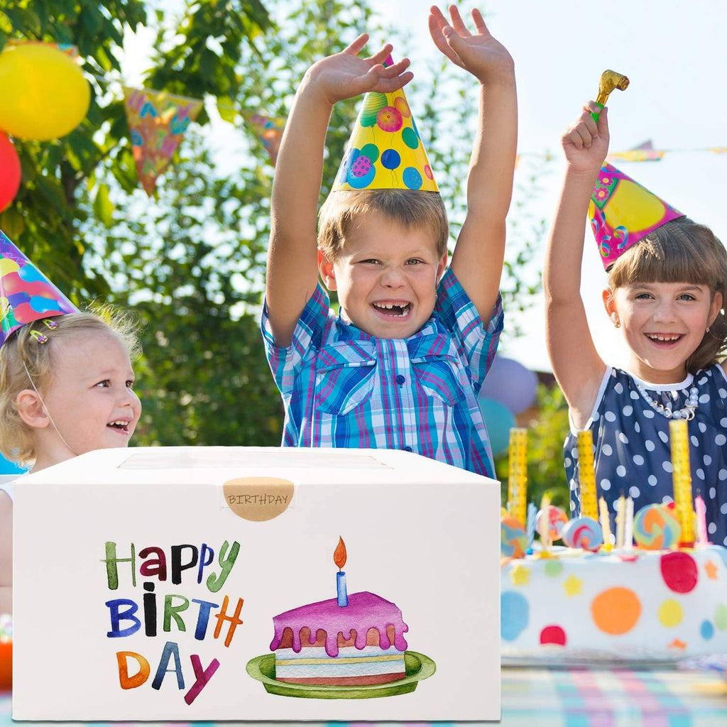 White square cake box with 'Happy Birth Day' artwork and a frosted cake inside.