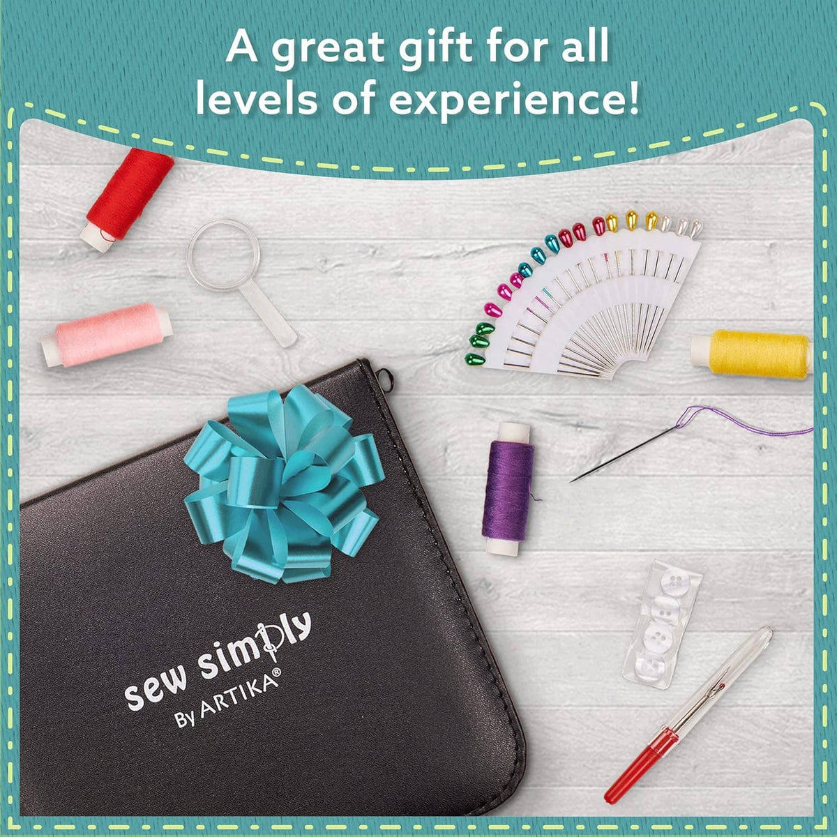 Black sewing kit case with a gift bow, plus thread spools and small sewing tools around it