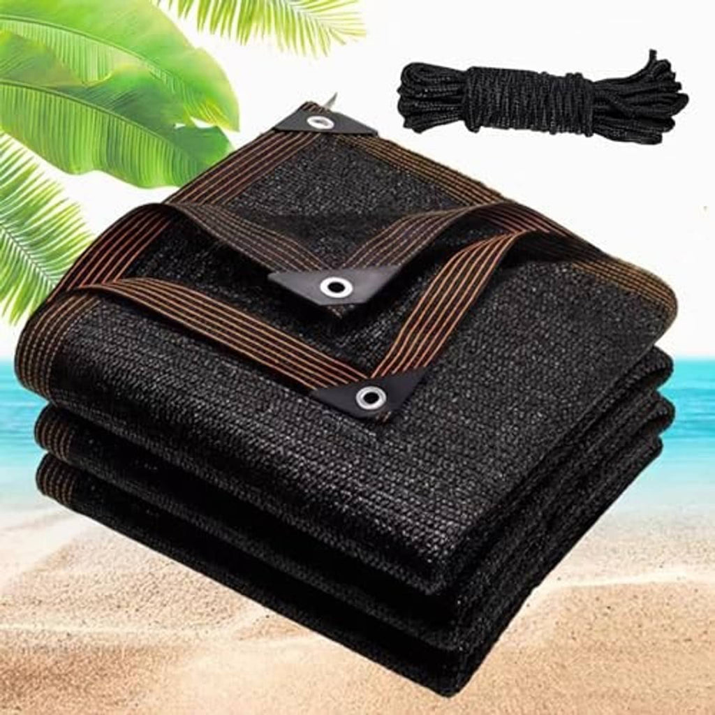 Black mesh shade cloth tarp with grommets, brown border stripes, and folded rope