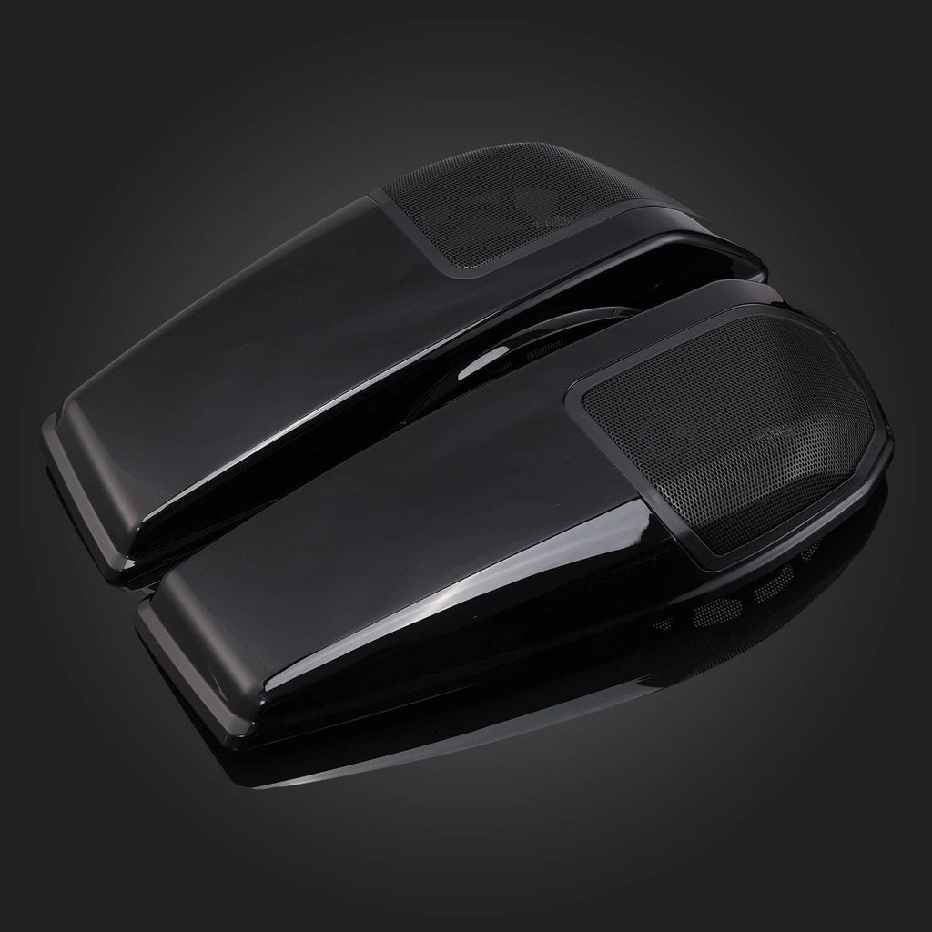Angled close-up of black saddlebag speaker lids with mesh grille panels