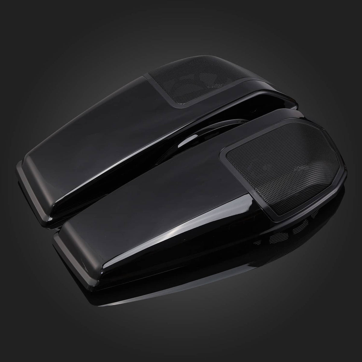 Angled close-up of black saddlebag speaker lids with mesh grille panels