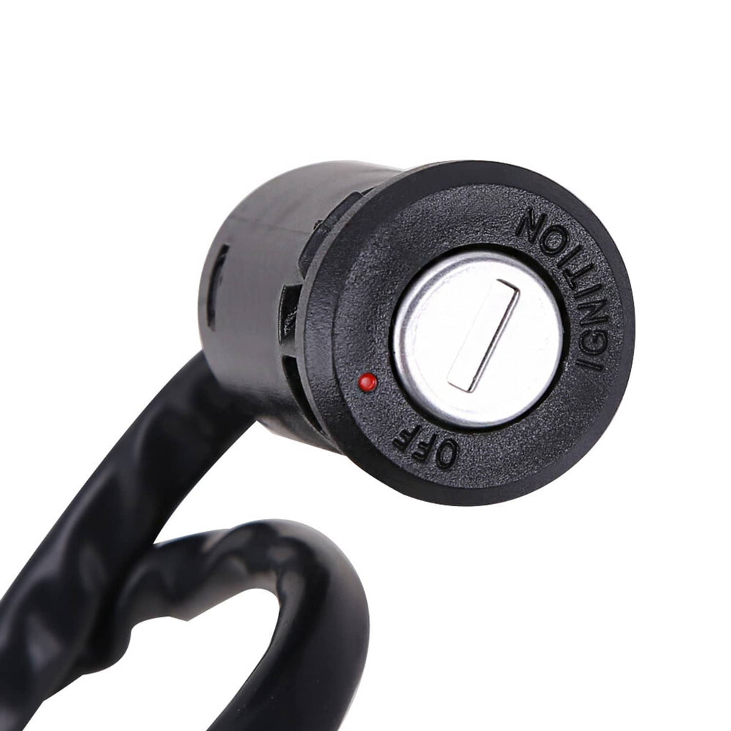 Black ignition key cylinder with metal key and red indicator dot