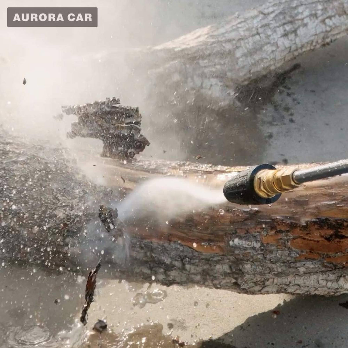 Turbo nozzle spraying water jet from black-and-brass tip onto dirty surface