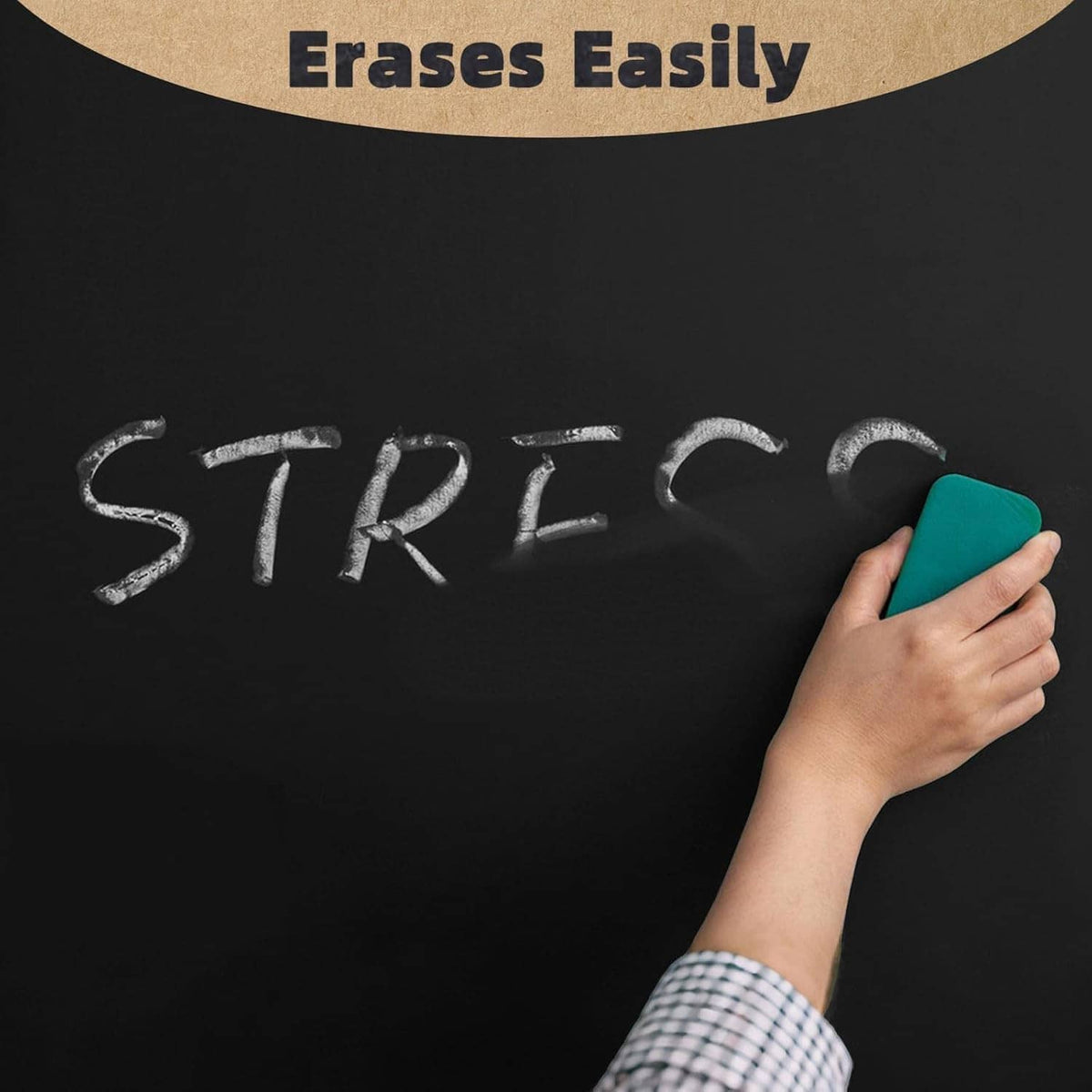 Chalk writing on a chalkboard wiped away with a green eraser