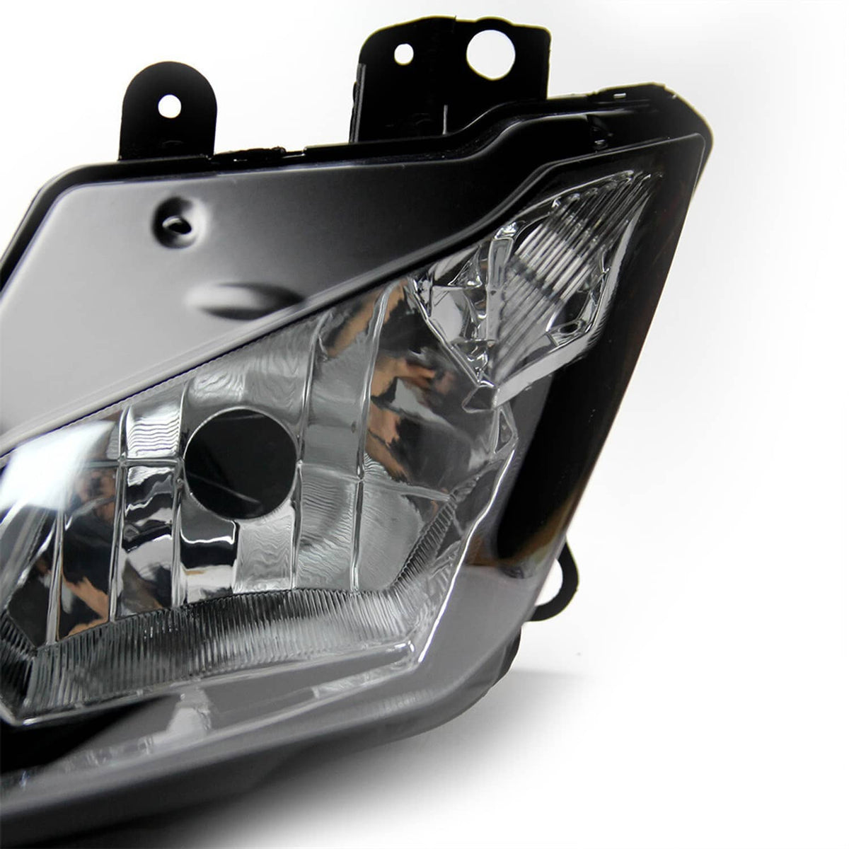 Motorcycle headlight lens close-up with clear reflector and black bezel