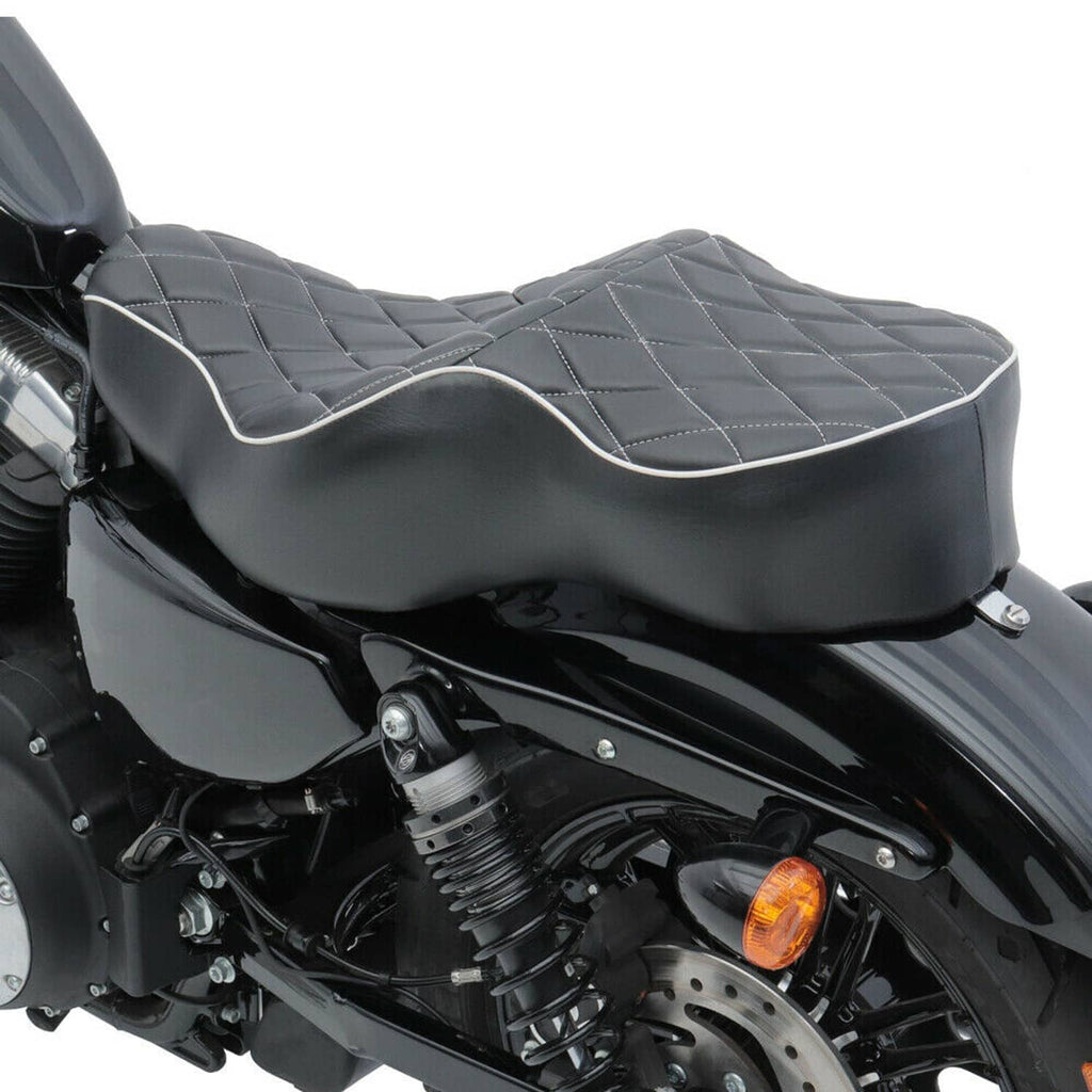 Two-up seat cushion with black quilted center and curved light piping edges