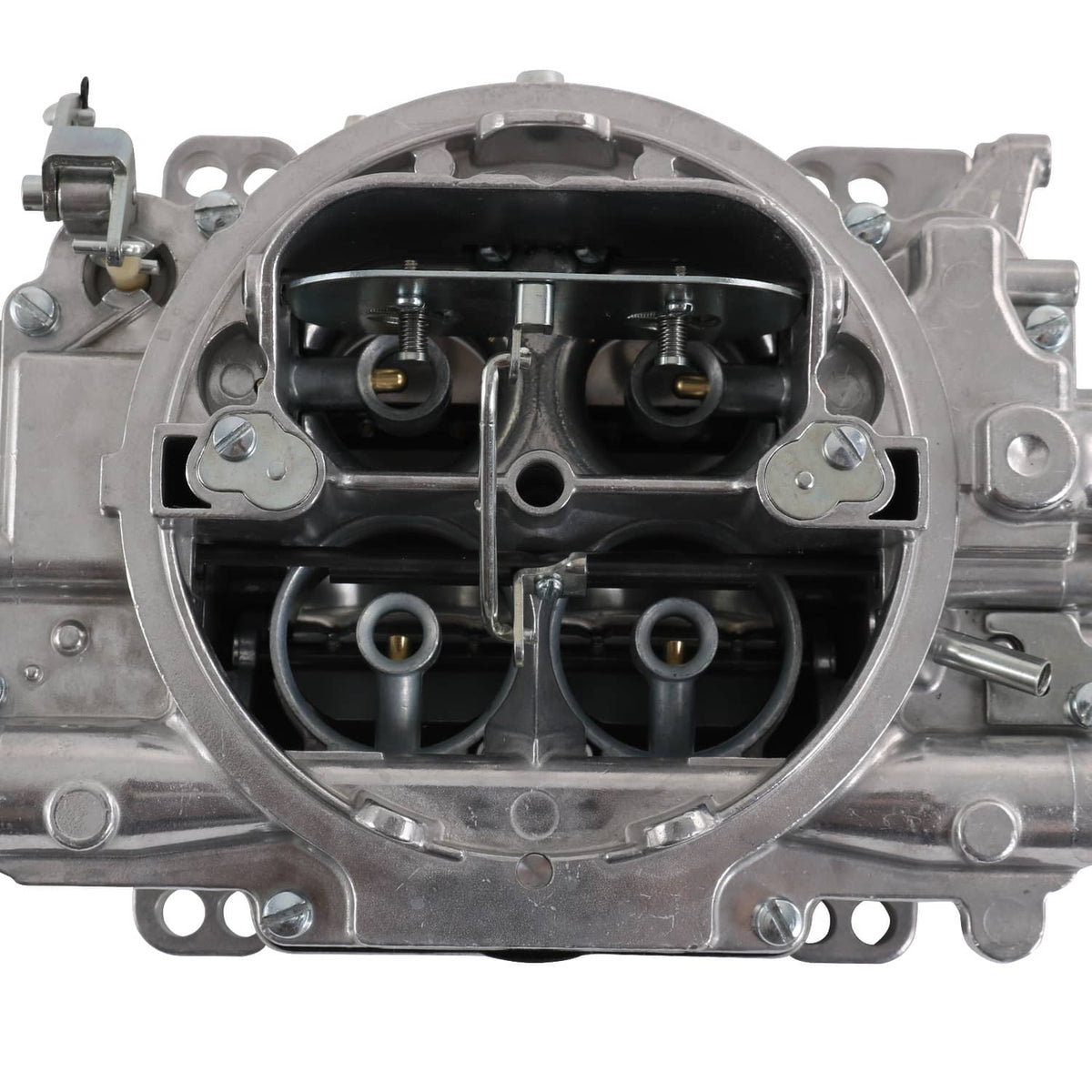 Carburetor interior close-up with dual throttle bores and metal air passages