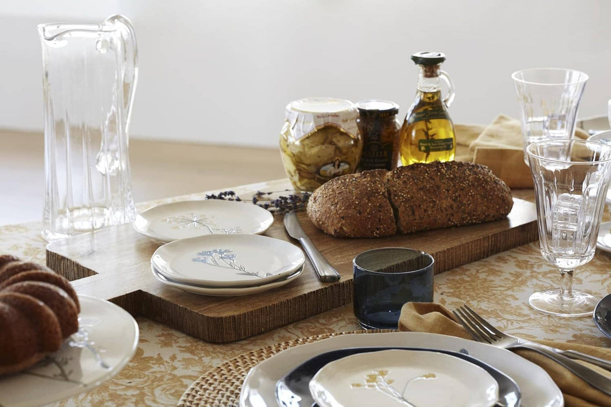 Set of 4 appetizer plates with wildflower sprig designs on white ceramic