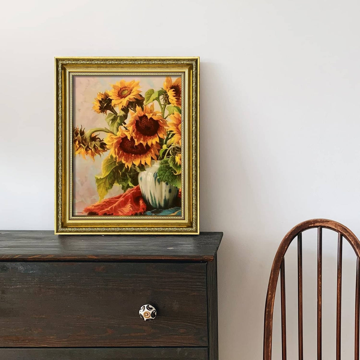 Ornate gold 8x10 picture frame displaying a floral sunflower print