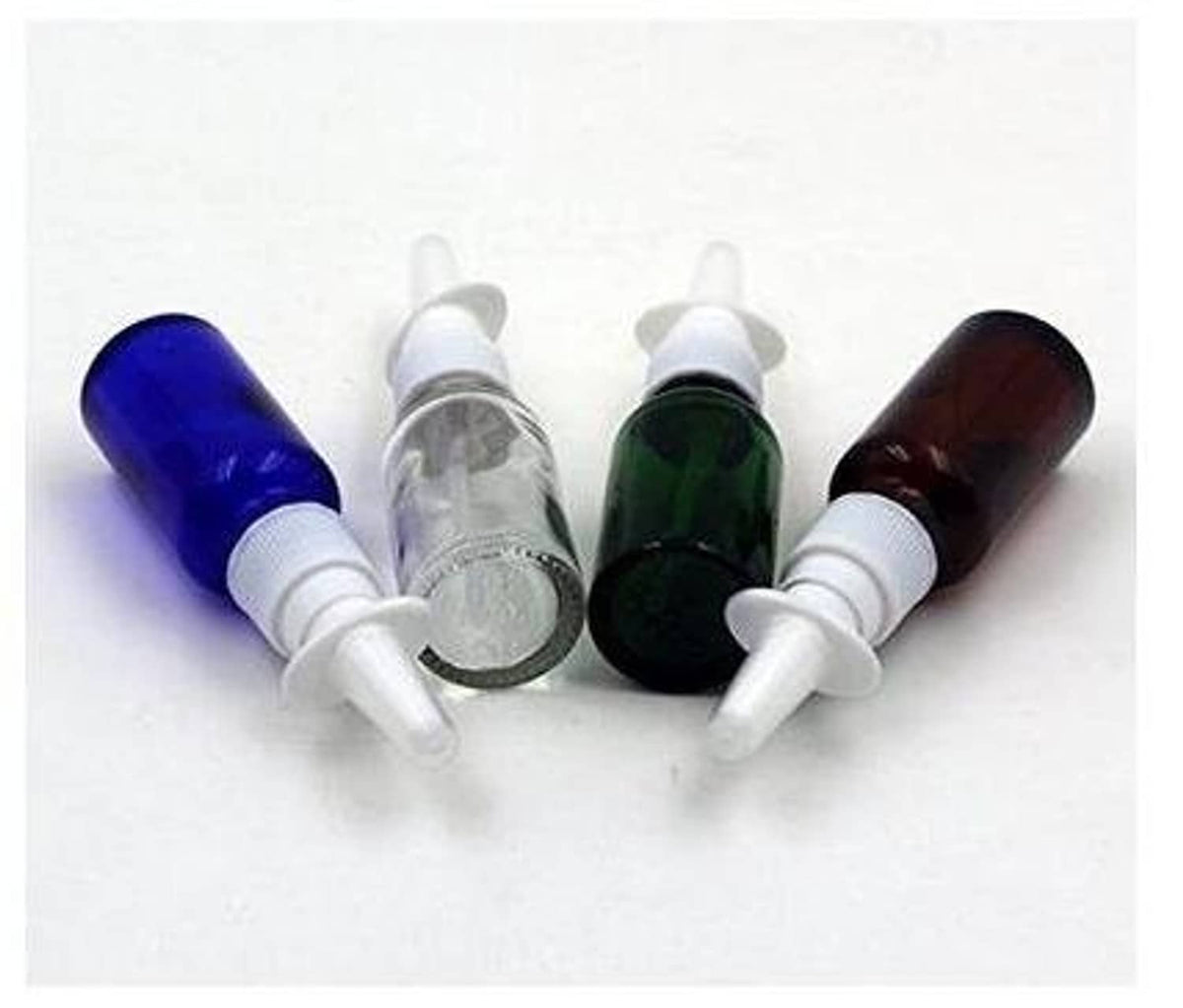 Set of refillable nasal bottles: blue, clear, green, and amber glass with white pumps