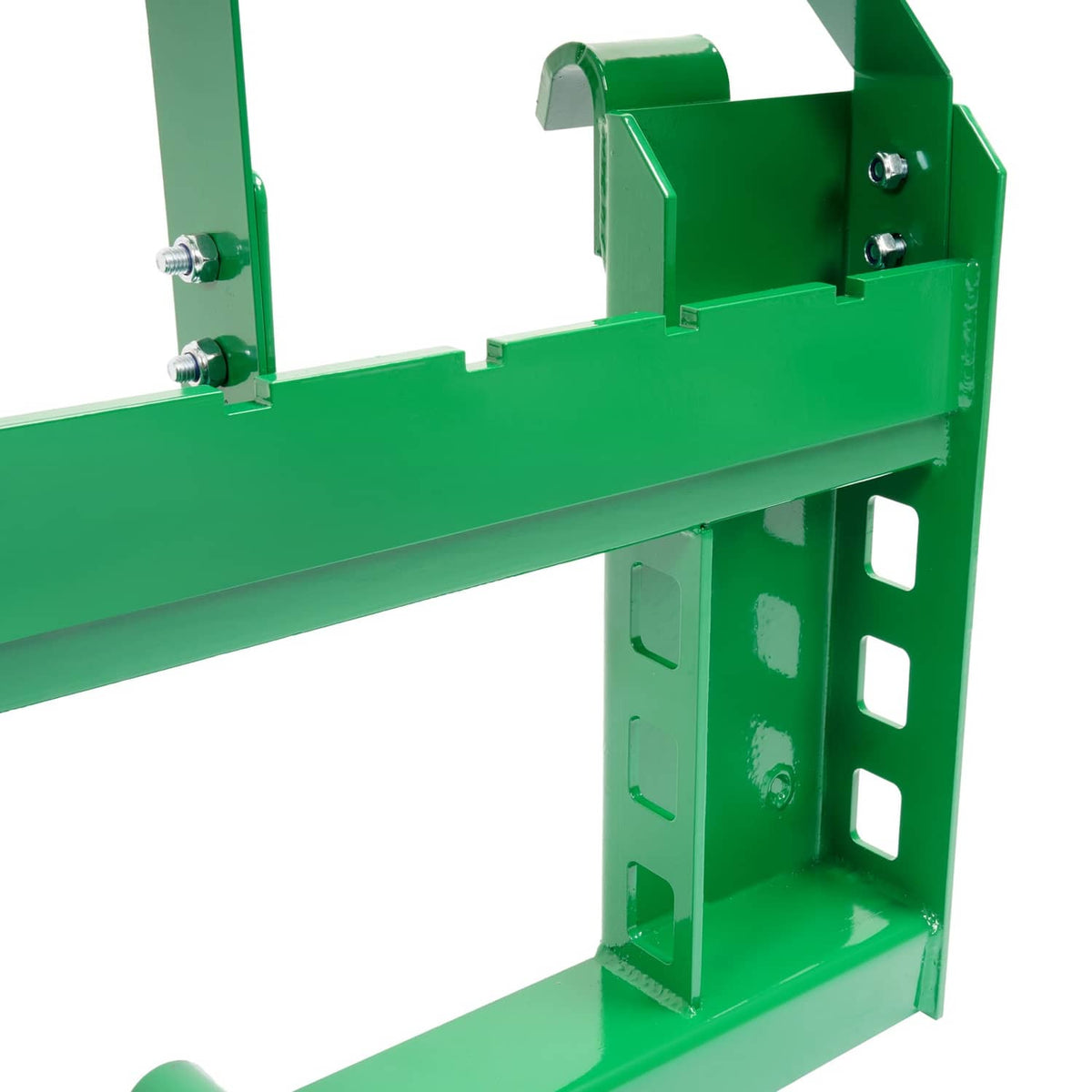 Close-up of green side bracket and mounting bolts on pallet fork frame