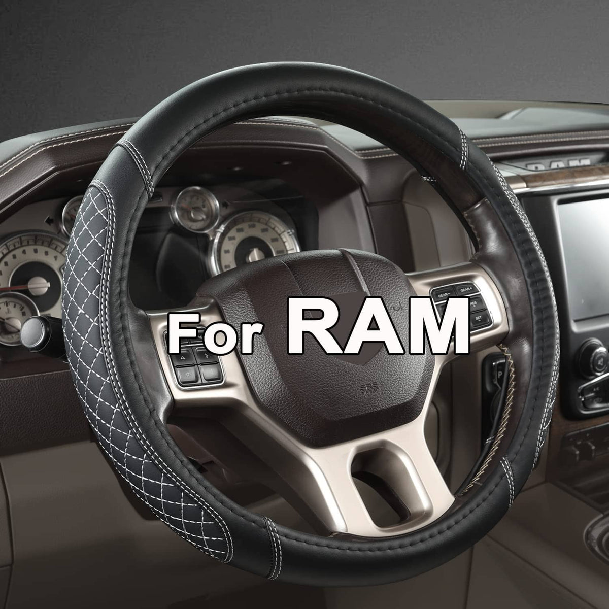 Black steering wheel cover with white stitched edge and quilted pattern over wheel rim