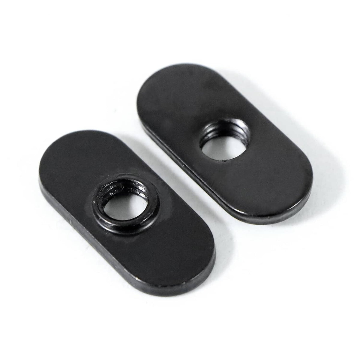 Pair of black 1/4-20 centered slide T-nuts, circular threaded openings