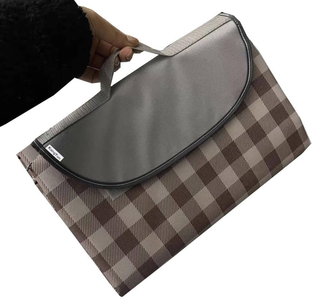 Brown and white checkered picnic blanket with gray zipper carry case, folded