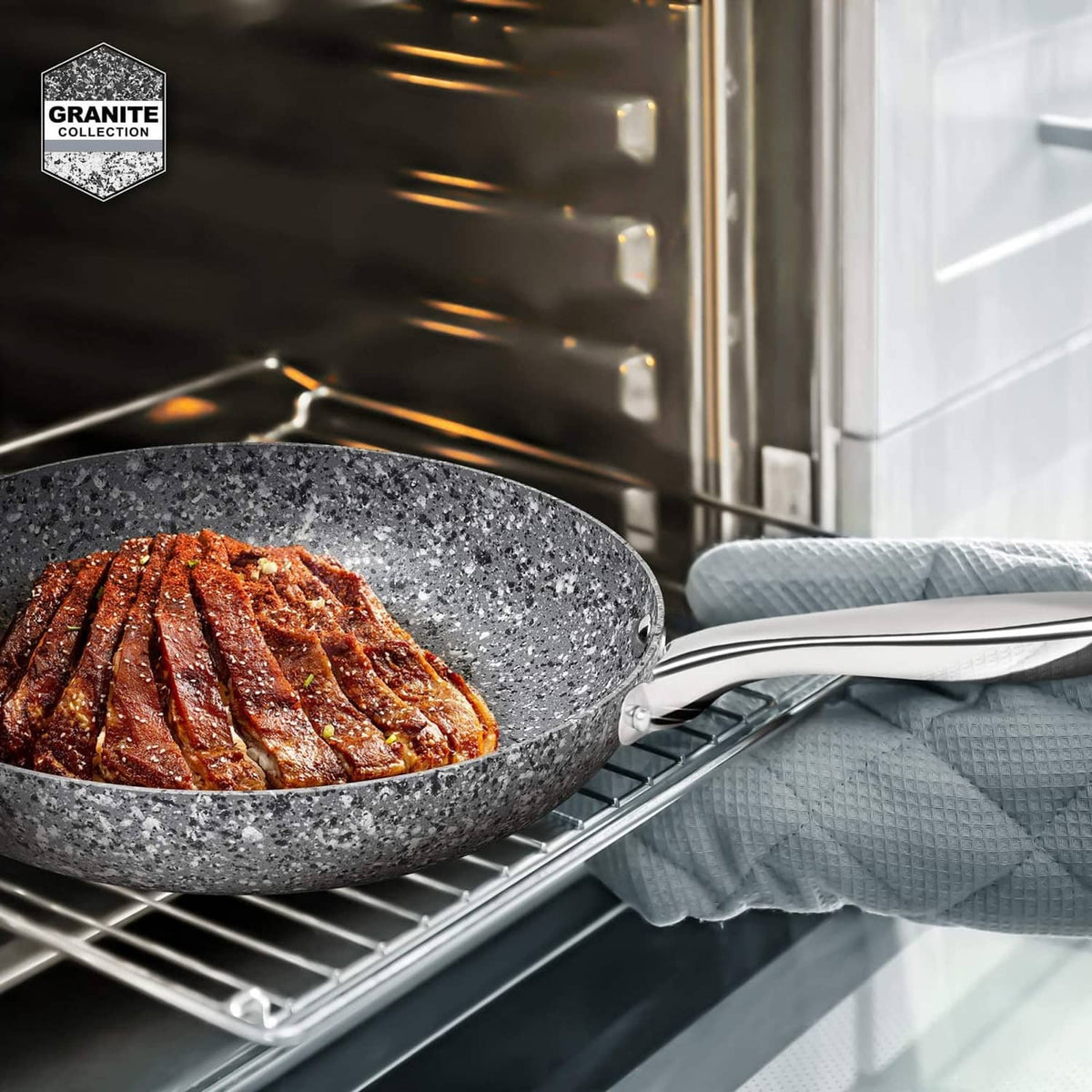 8-in gray granite nonstick skillet on oven rack, seared meat in pan.