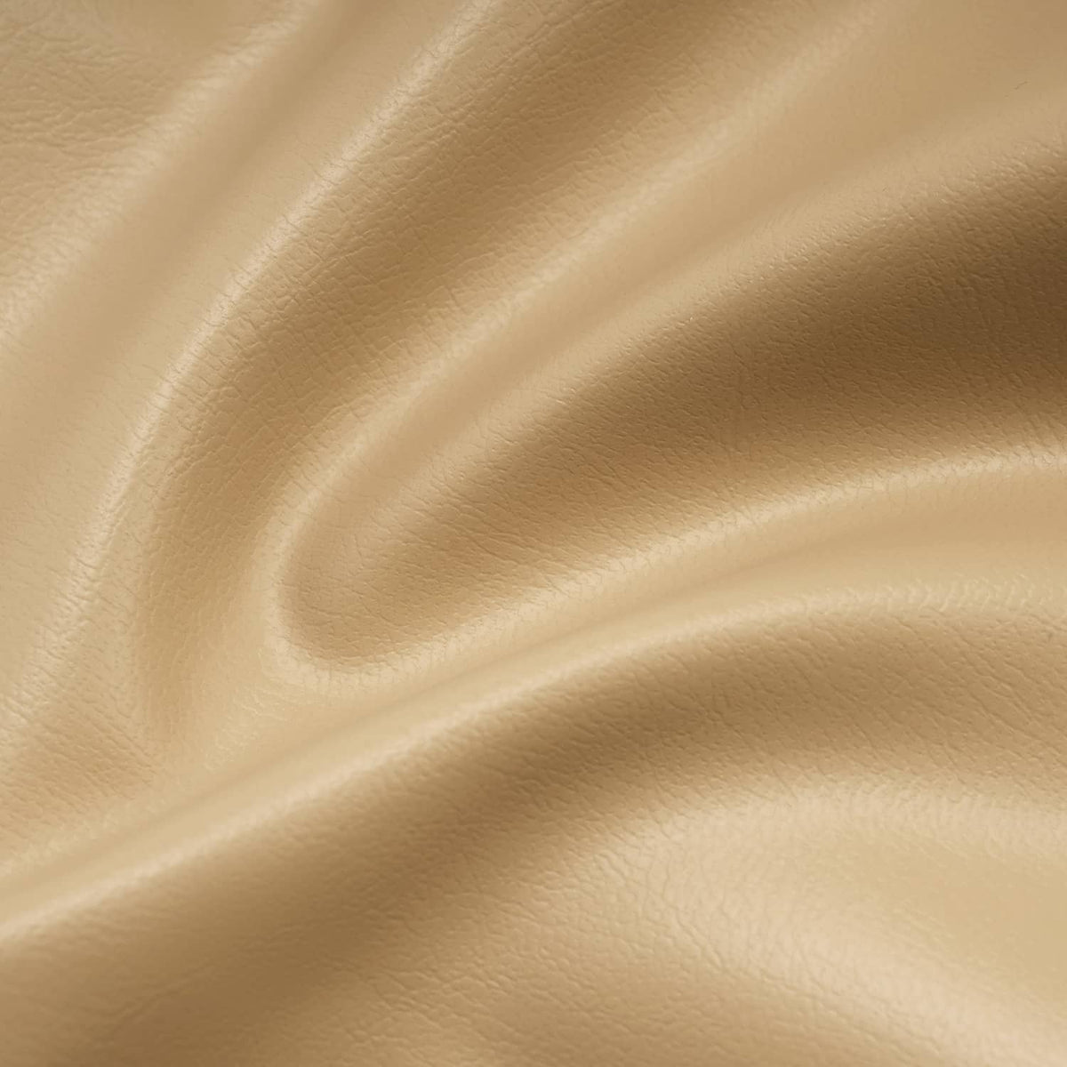 Tan golf cart seat back cover, angled close-up of tan vinyl texture