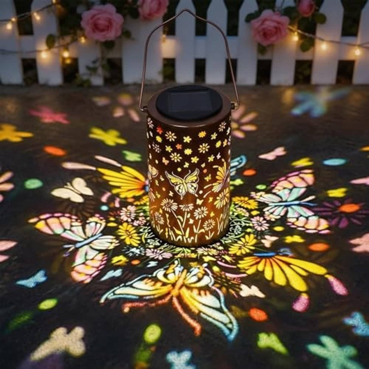 Solar lantern with butterfly and flower motif, hanging handle, black solar cap