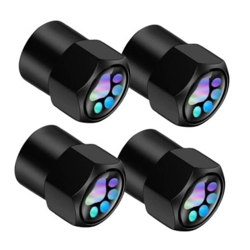 Set of 4 black hexagonal alloy tire valve stem caps with glowing paw prints