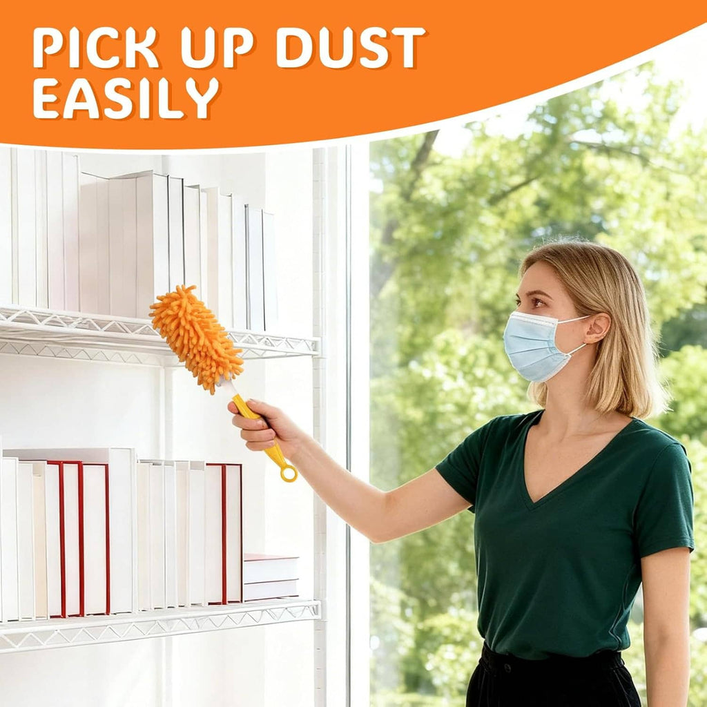 Orange microfiber hand duster refill on yellow handle, held for dusting windowsills.