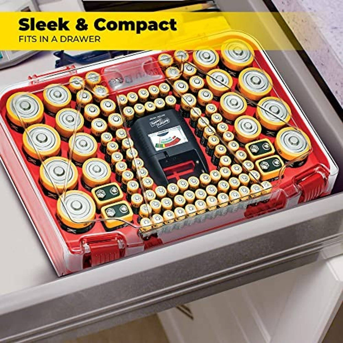 Red battery organizer case with many batteries inside, designed to fit in a drawer