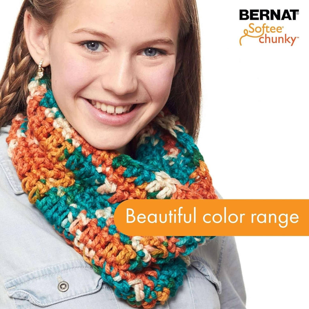 Chunky multicolor crochet infinity scarf with orange, teal, green, and cream stripes