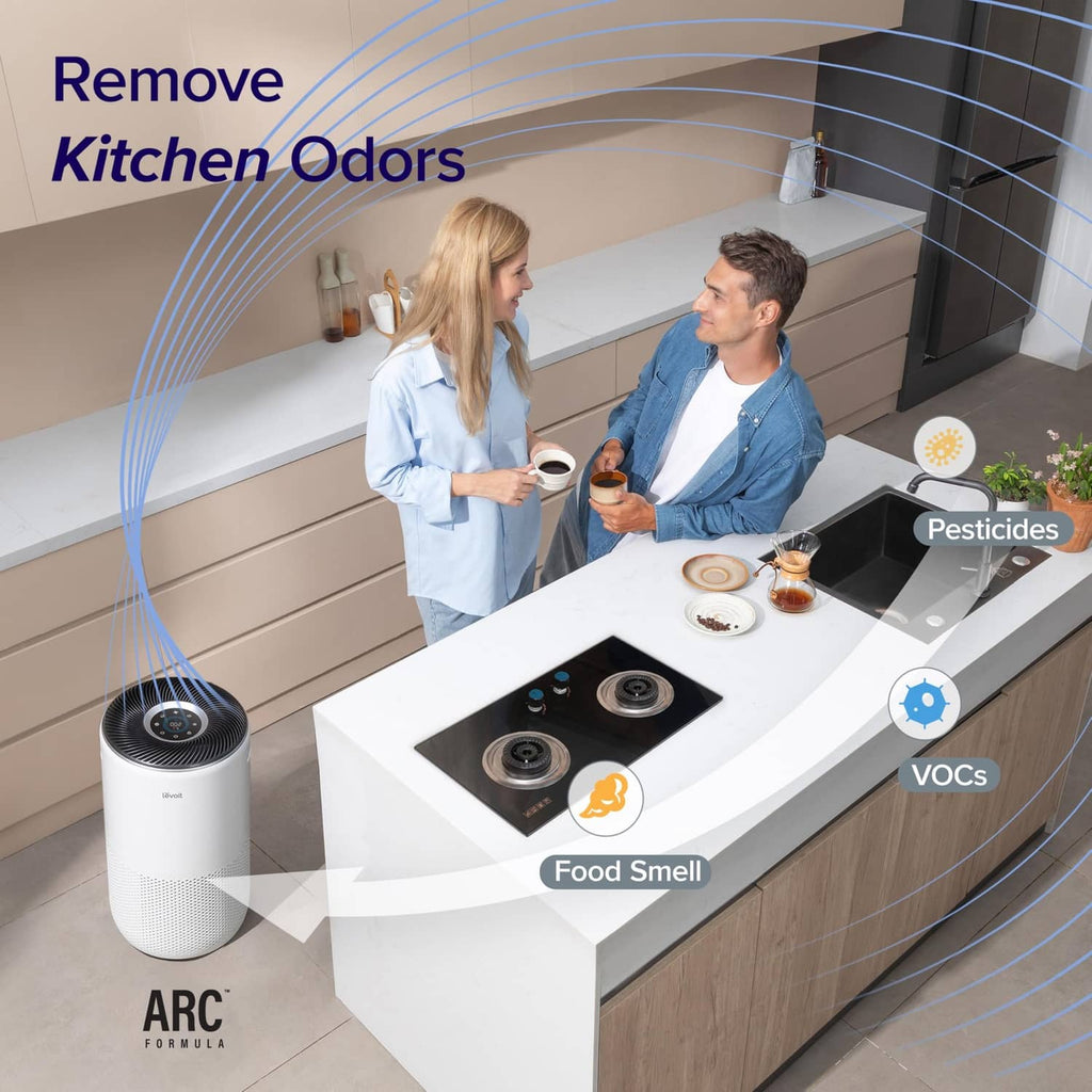 Cream white air purifier standing on a counter edge with perforated intake