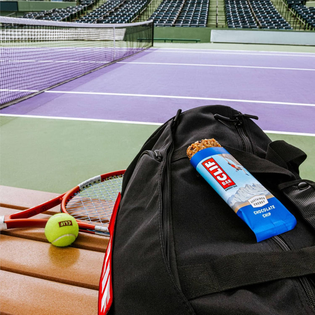 Chocolate chip energy bar in a black tennis bag pocket