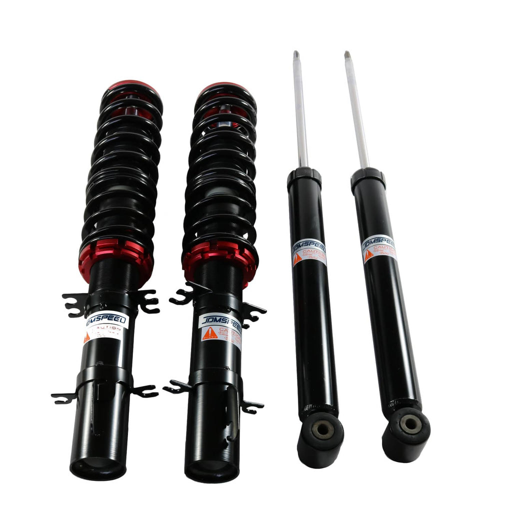 Coilover kit set with black shocks, red collars, silver rods, and spring assemblies