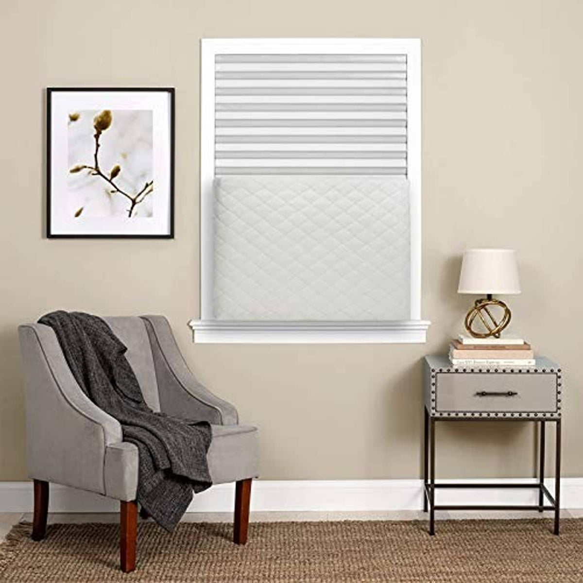 Beige quilted indoor AC cover on window-mounted air conditioner, rectangular front cover