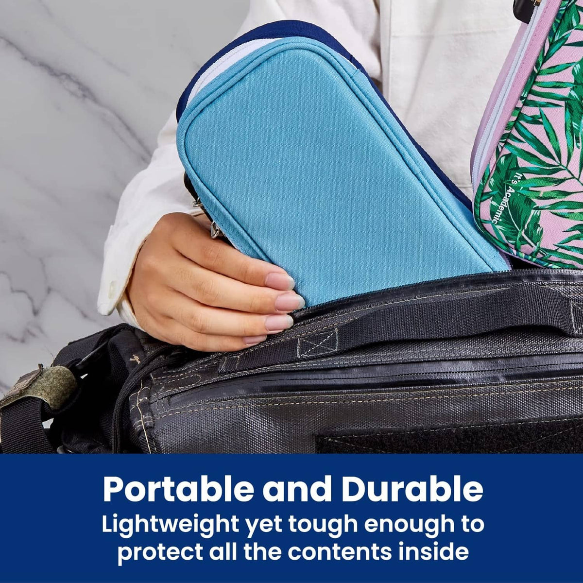 Blue locking pencil case held by hand with zipper closure and front latch.