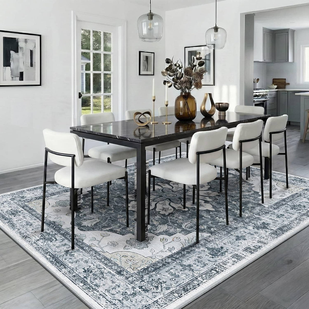 Blue-gray ornate area rug under a dining table with chairs
