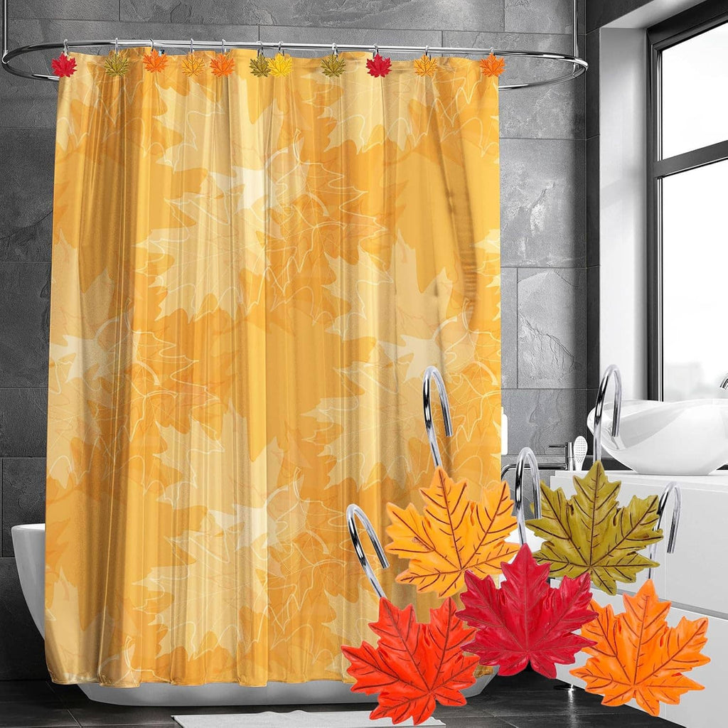Leaf shower curtain hooks on a shower curtain; chrome hangers with orange and red leaf decor