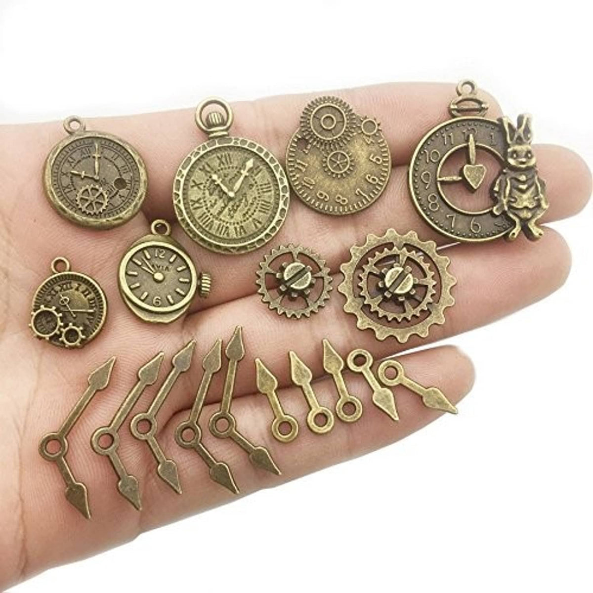 Antique bronze steampunk watch dials, gears, and charm pendants on hand