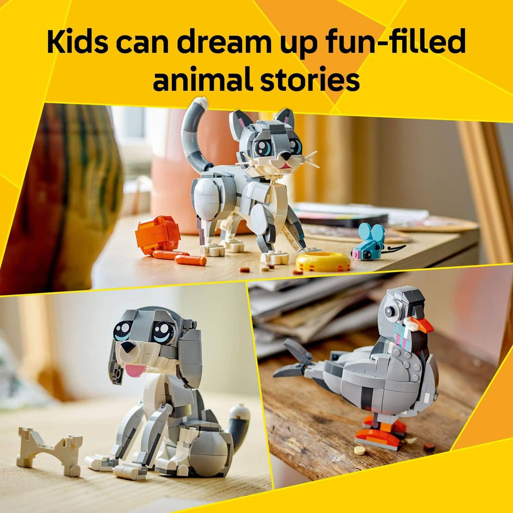 LEGO grey cat model with orange crate and small blue animal figure on tabletop