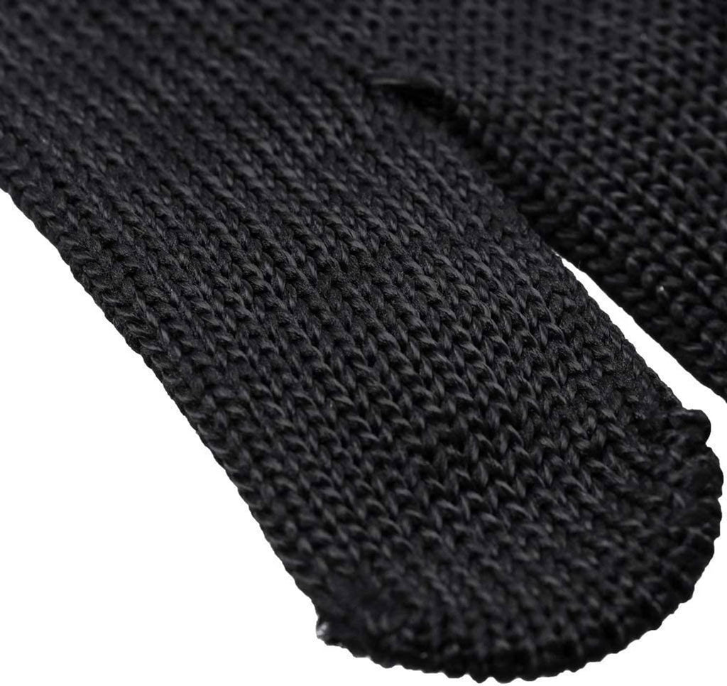Black knit glove cuff and palm texture close-up, tightly woven fabric