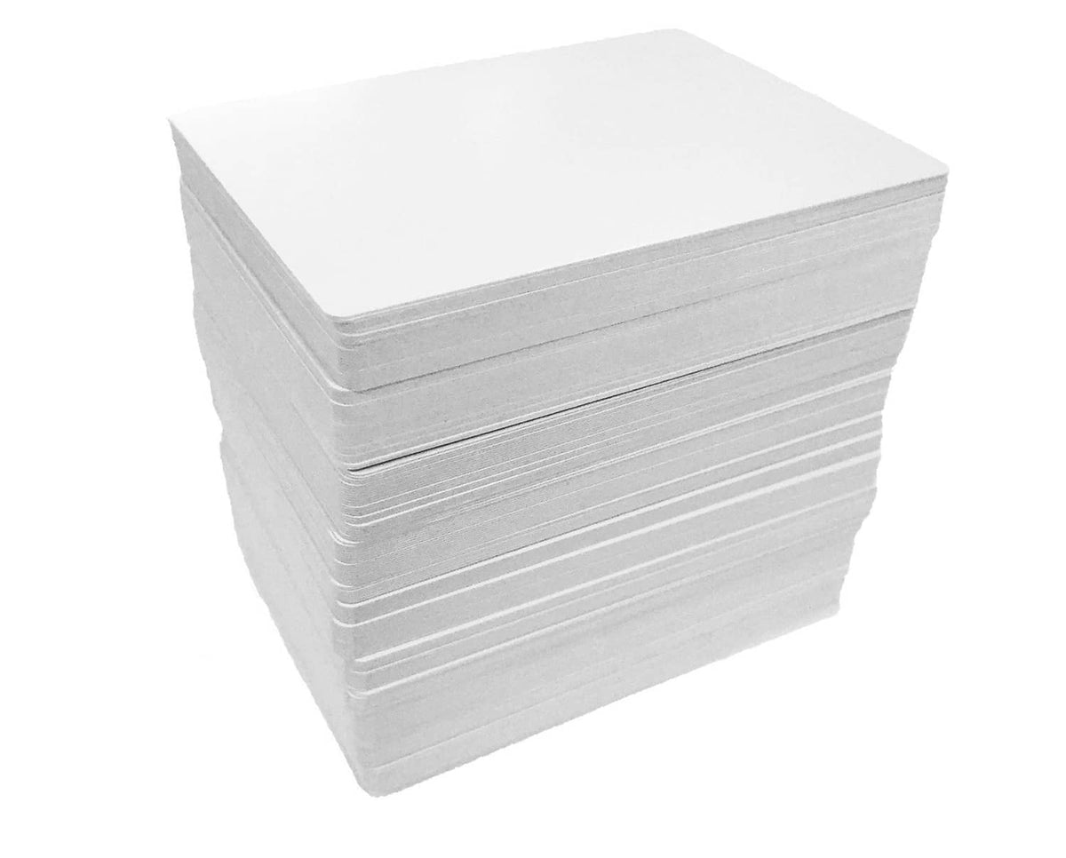 Thick stack of white blank playing cards in a tight pack
